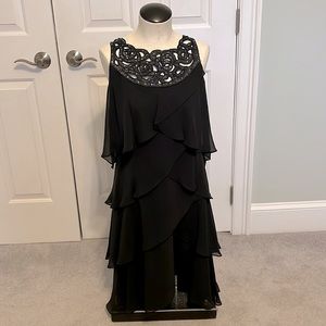 Elegant, flattering black dress with sequins on top and layers of ruffles